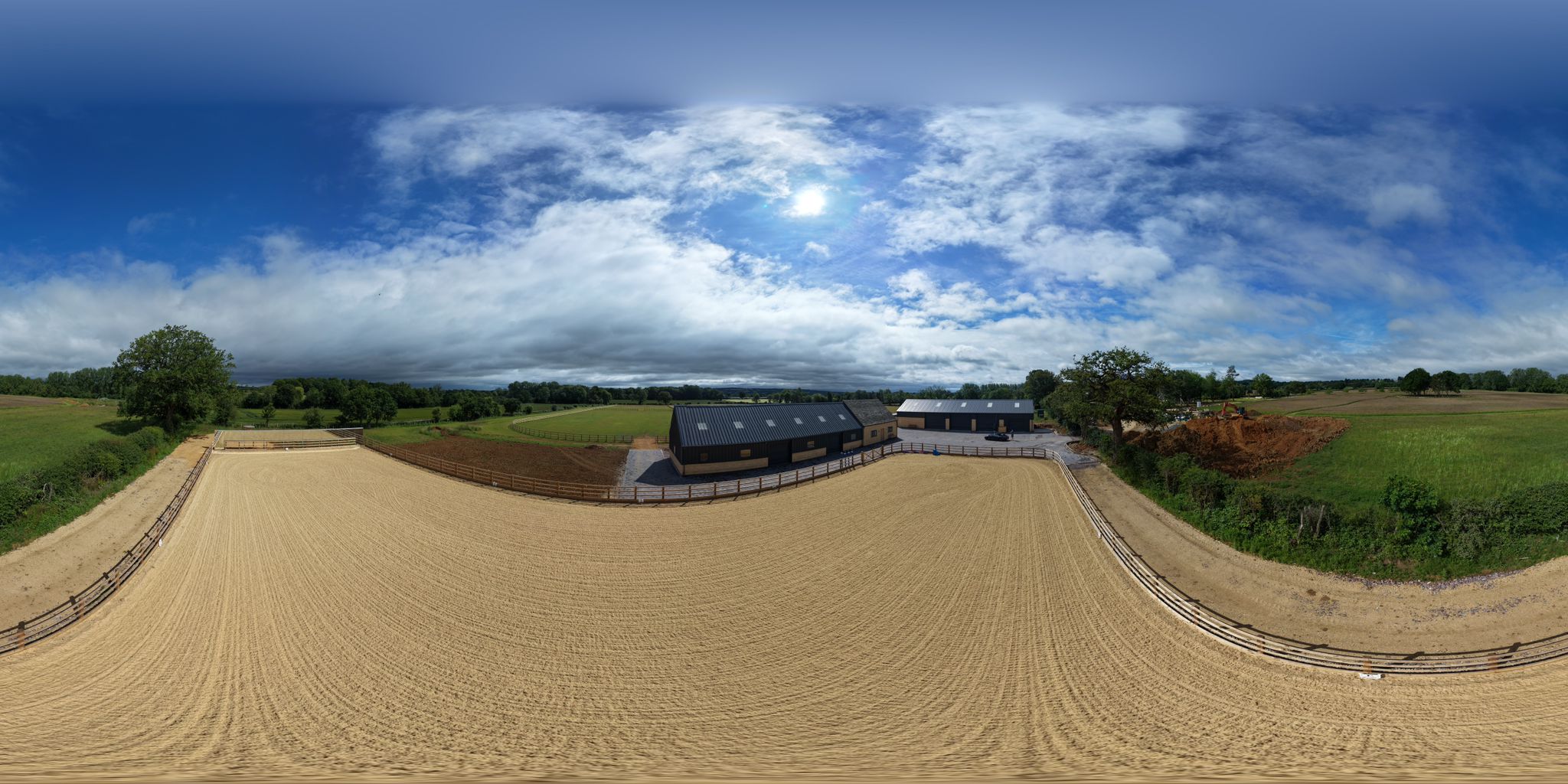 Aerial 360 view of a TC Rowan steel-framed equestrian building and riding arena in the Oxfordshire countryside